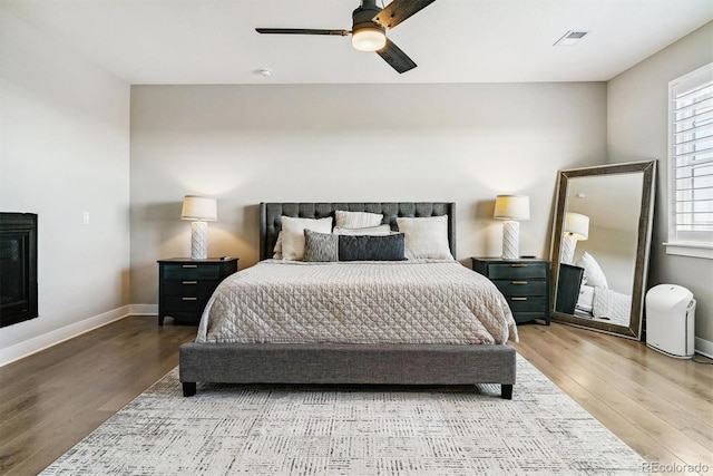 bedroom featuring hardwood / wood-style flooring and ceiling fan