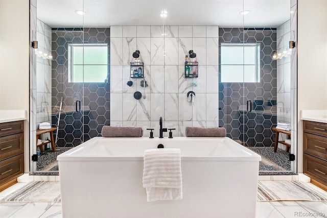 bathroom featuring vanity, separate shower and tub, and tile walls