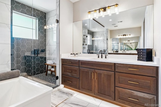 bathroom featuring vanity and shower with separate bathtub