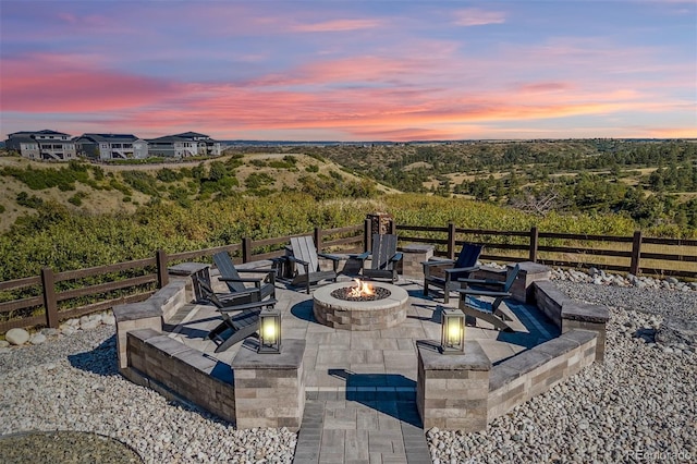 patio terrace at dusk with an outdoor fire pit