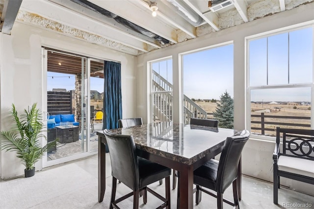 dining area with concrete flooring and visible vents