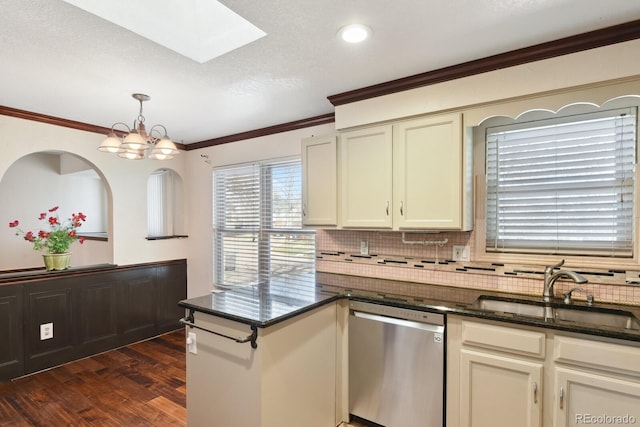 kitchen with a sink, stainless steel dishwasher, dark wood finished floors, a peninsula, and crown molding