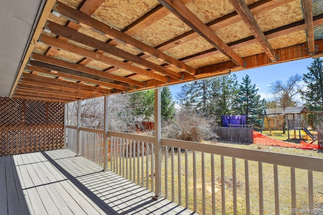 wooden terrace with a playground