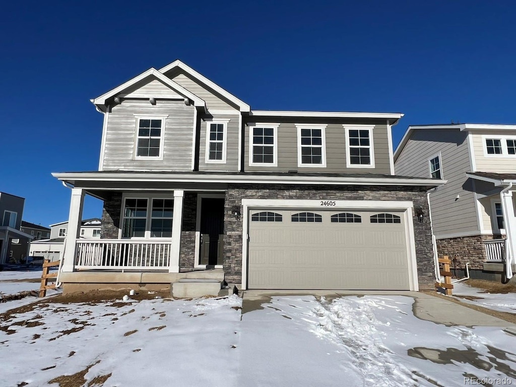 view of front of house with a porch and a garage