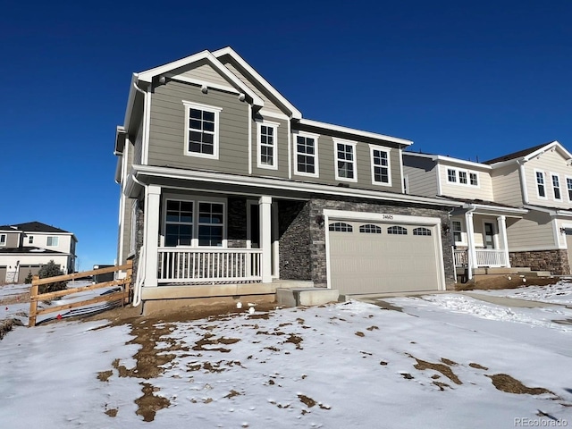 view of front of home with a porch and a garage