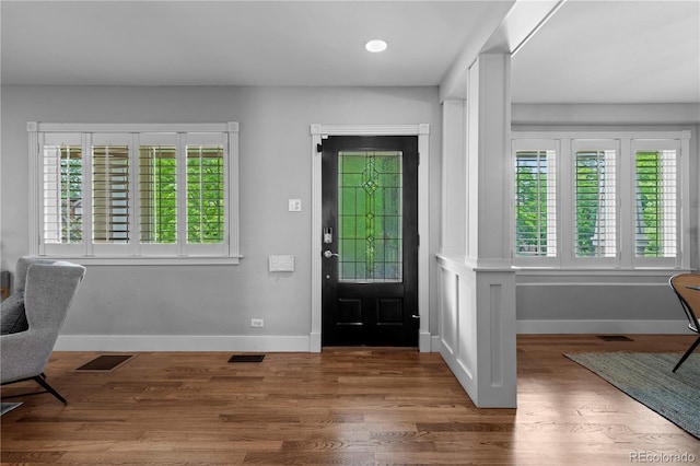 1366 S Vine St, Denver, CO 80210 - foyer entrance with plenty of natural light, baseboards, wood finished floors, and recessed lighting