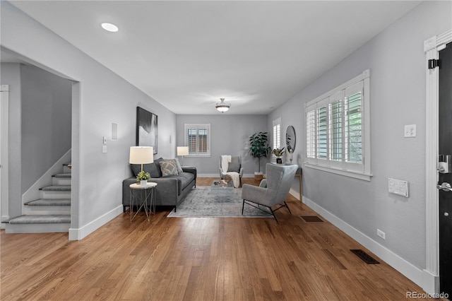 1366 S Vine St, Denver, CO 80210 - living room featuring stairway, wood finished floors, and baseboards