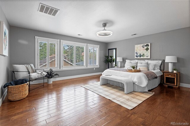 1366 S Vine St, Denver, CO 80210 - bedroom featuring baseboards and wood finished floors