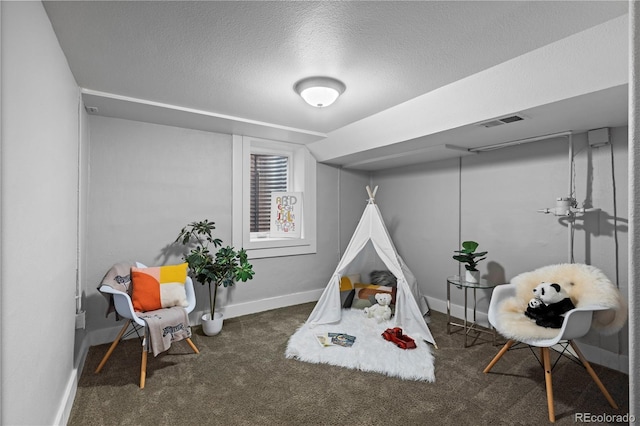 1366 S Vine St, Denver, CO 80210 - game room featuring carpet flooring, a textured ceiling, and baseboards