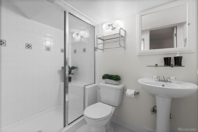 1366 S Vine St, Denver, CO 80210 - bathroom featuring toilet, a shower stall, and a textured ceiling
