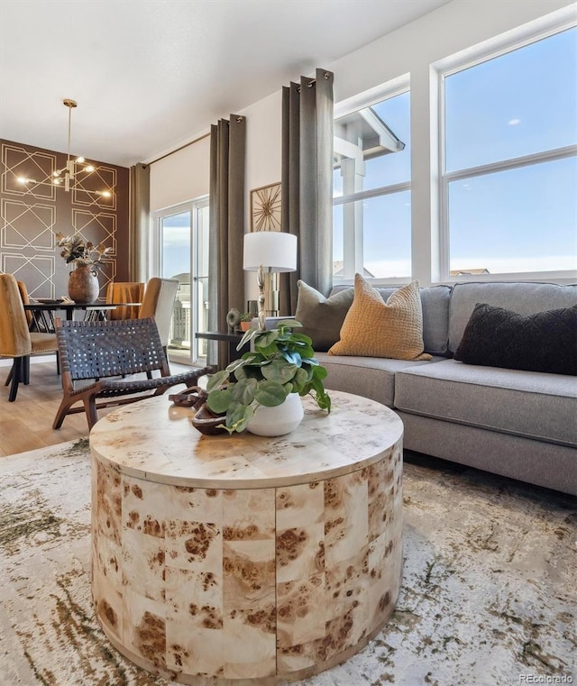 living room with wood-type flooring and a chandelier