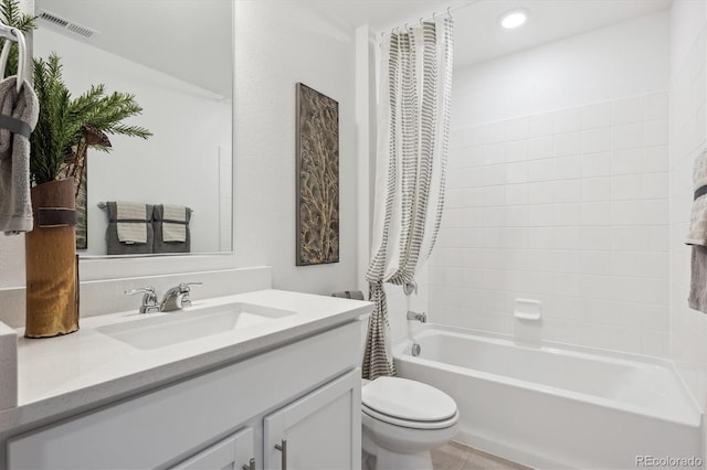 full bathroom with vanity, tub / shower combination, and toilet