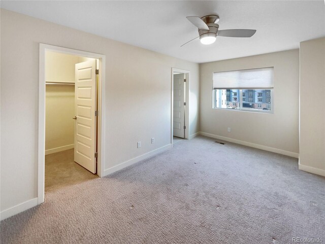 11267 Central Ct, Broomfield, CO 80021 - unfurnished bedroom featuring carpet, a walk in closet, and ceiling fan