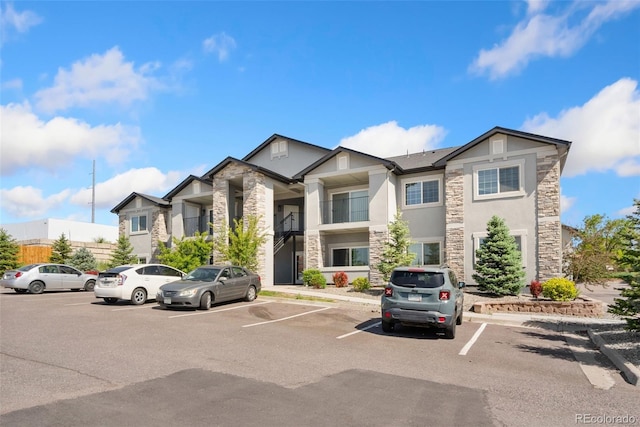 875 E 78th Ave Unit 52, Denver, CO 80229 - view of property with uncovered parking