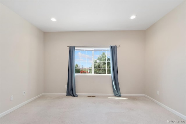 875 E 78th Ave Unit 52, Denver, CO 80229 - empty room with light carpet, baseboards, and recessed lighting