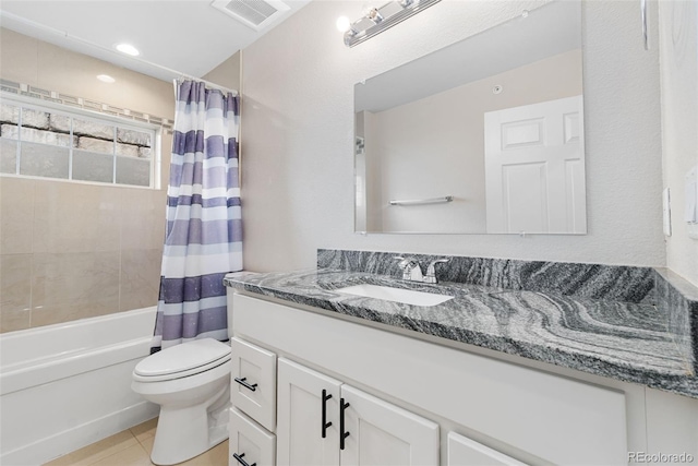 875 E 78th Ave Unit 52, Denver, CO 80229 - bathroom featuring toilet, vanity, shower / tub combo, and tile patterned floors