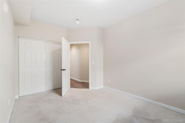 875 E 78th Ave Unit 52, Denver, CO 80229 - unfurnished bedroom featuring carpet floors, baseboards, and a closet