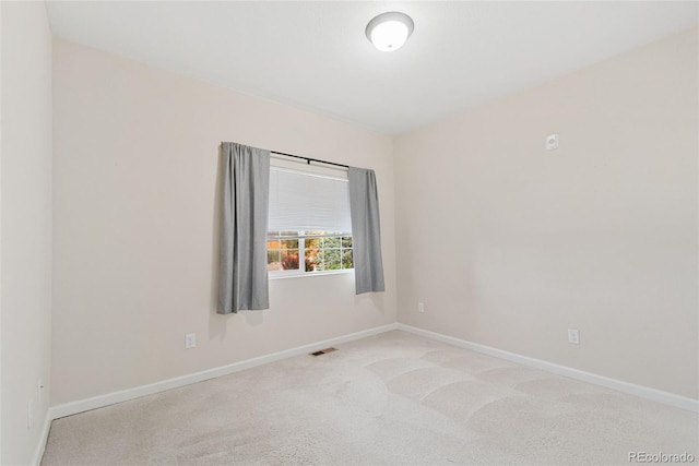 875 E 78th Ave Unit 52, Denver, CO 80229 - carpeted empty room featuring baseboards