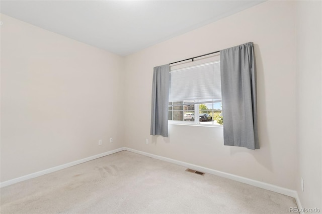 875 E 78th Ave Unit 52, Denver, CO 80229 - spare room featuring carpet floors and baseboards