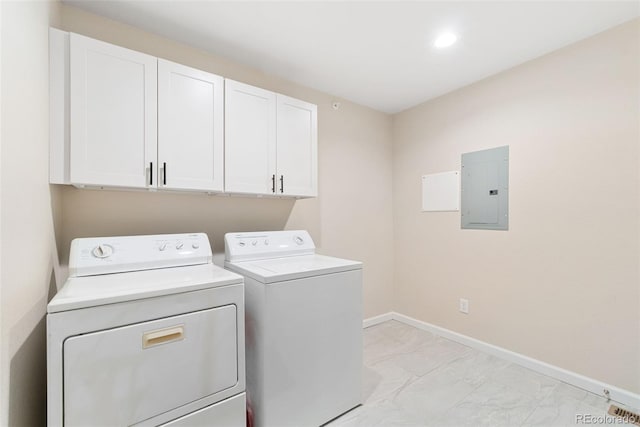 875 E 78th Ave Unit 52, Denver, CO 80229 - laundry area featuring electric panel, washing machine and clothes dryer, cabinet space, light marble finish floors, and baseboards