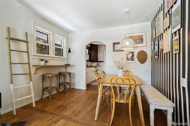 dining space featuring wood-type flooring