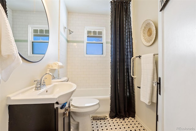 full bathroom with vanity, toilet, and shower / tub combo with curtain