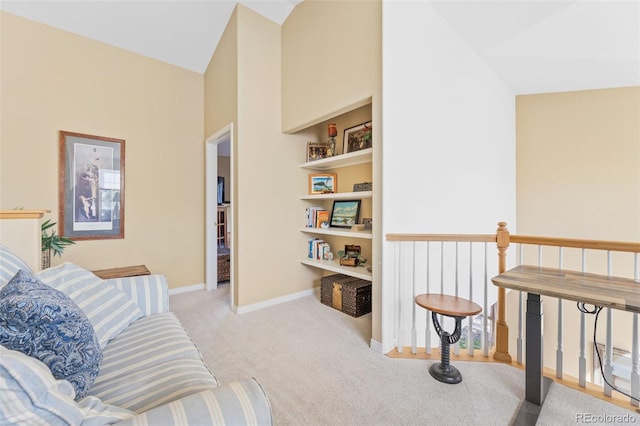 interior space featuring light colored carpet and high vaulted ceiling