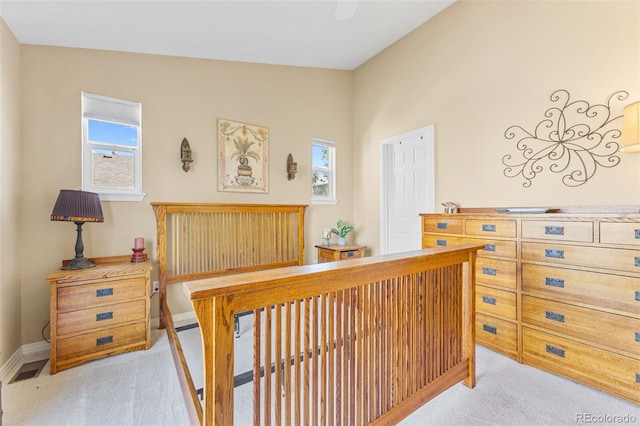 carpeted bedroom featuring lofted ceiling