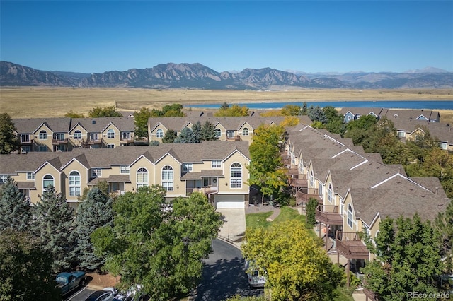 bird's eye view with a water and mountain view