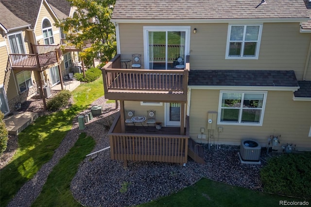 rear view of house featuring a deck, central AC, and a patio area