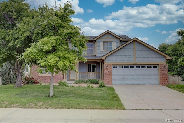 2253 E 100th Pl, Thornton, CO 80229 - view of front facade with brick siding, driveway, a front lawn, a garage, and covered porch
