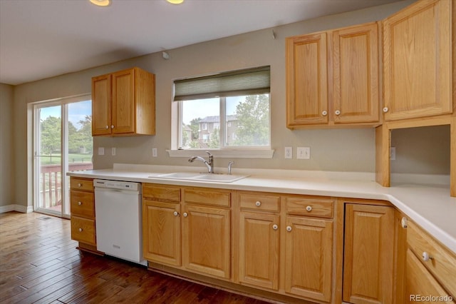 2253 E 100th Pl, Thornton, CO 80229 - kitchen featuring dishwasher, a sink, dark wood-style flooring, and light countertops