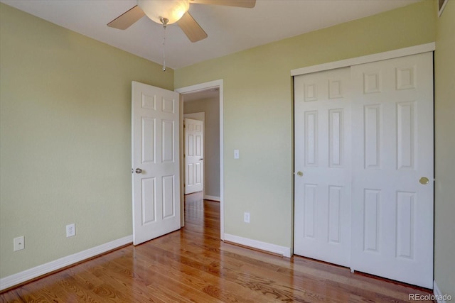 2253 E 100th Pl, Thornton, CO 80229 - unfurnished bedroom with wood finished floors, baseboards, a closet, and ceiling fan
