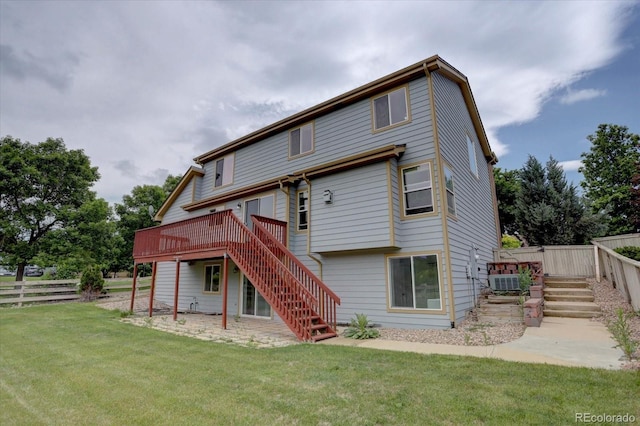 2253 E 100th Pl, Thornton, CO 80229 - rear view of house with stairs and a wooden deck