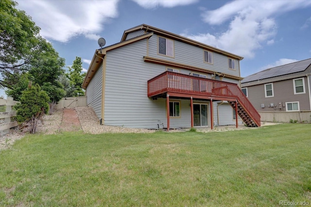 2253 E 100th Pl, Thornton, CO 80229 - back of property with a deck, stairway, and a gate