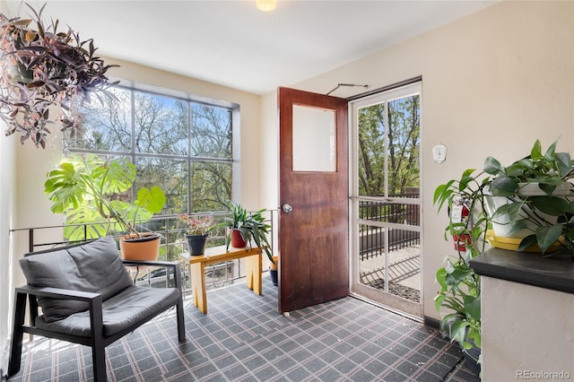 doorway to outside featuring tile patterned floors