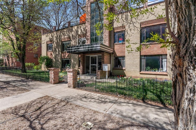 view of property with a fenced front yard