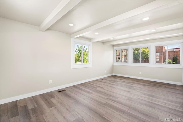 235 S 8th Ave, Brighton, CO 80601 - spare room with beamed ceiling, baseboards, wood finished floors, and recessed lighting
