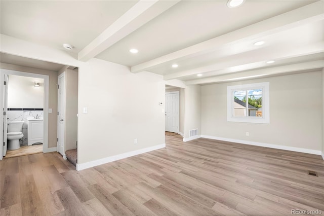 235 S 8th Ave, Brighton, CO 80601 - spare room featuring light wood-type flooring, beamed ceiling, baseboards, recessed lighting, and a sink