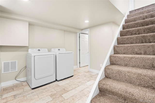 235 S 8th Ave, Brighton, CO 80601 - washroom with recessed lighting, baseboards, separate washer and dryer, and light stone finish flooring