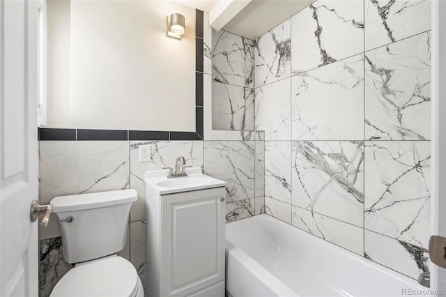 235 S 8th Ave, Brighton, CO 80601 - bathroom featuring vanity, toilet, shower / washtub combination, and tile walls