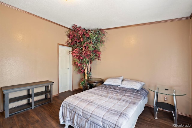 bedroom featuring dark hardwood / wood-style flooring and crown molding