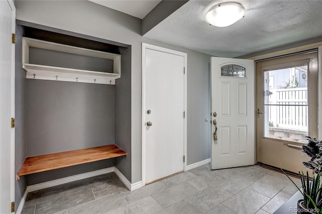 2829 S Xanadu Way, Aurora, CO 80014 - mudroom with baseboards and a textured ceiling