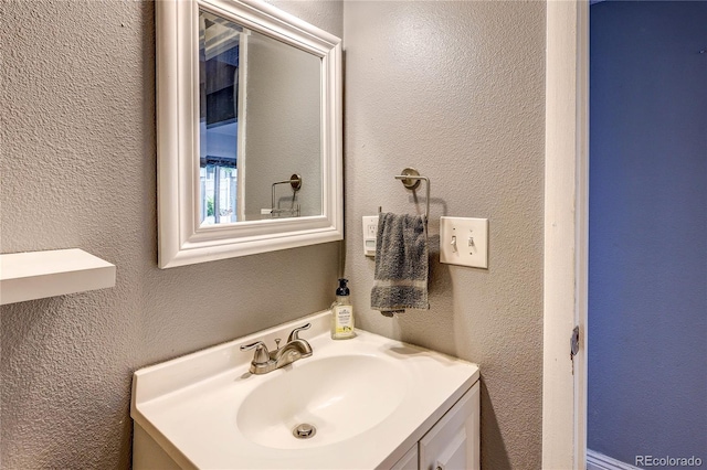2829 S Xanadu Way, Aurora, CO 80014 - bathroom with a textured wall and vanity