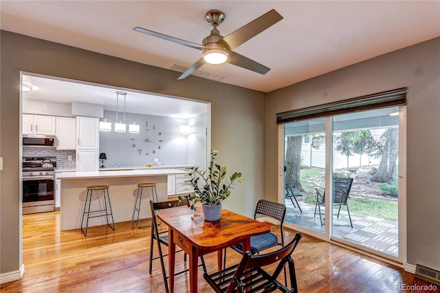 2829 S Xanadu Way, Aurora, CO 80014 - dining space with light wood-style floors and ceiling fan