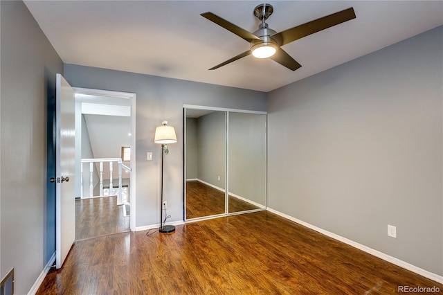 2829 S Xanadu Way, Aurora, CO 80014 - unfurnished bedroom featuring wood finished floors, a closet, and ceiling fan
