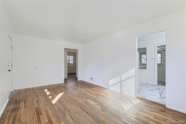 spare room featuring light wood-type flooring