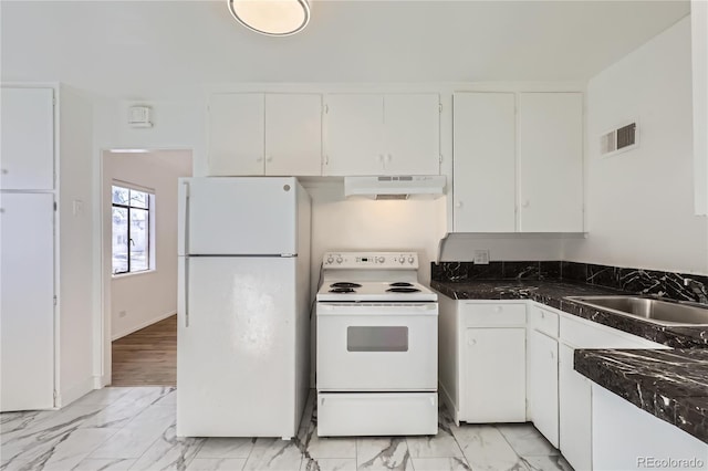 kitchen with sink, white cabinets, white appliances, and dark stone counters