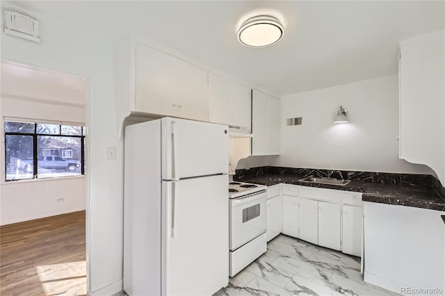 kitchen with white cabinetry, white appliances, and sink