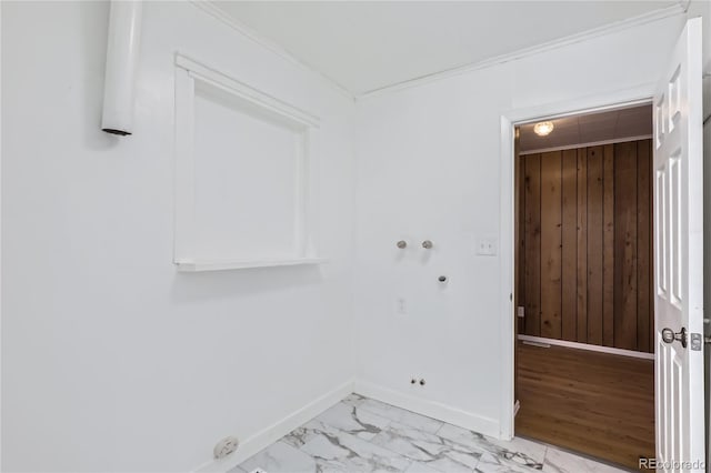 laundry room featuring hookup for a gas dryer, crown molding, hookup for a washing machine, and wooden walls